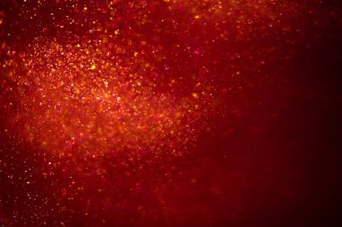 Abstract red background with sparkles and shadows. Fluidity, waves, glitter, fluid, glitter, shimmer.