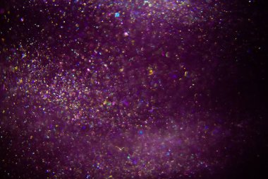 Abstract purple, magenta background with sparkles and shadows. Fluidity, waves, glitter, fluid, glitter, shimmer.