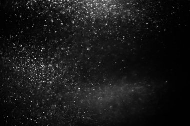 Abstract black background with sparkles and shadows. Fluidity, waves, glitter, fluid, glitter, shimmer. Stars, stardust, space, outer space, comets, placer.