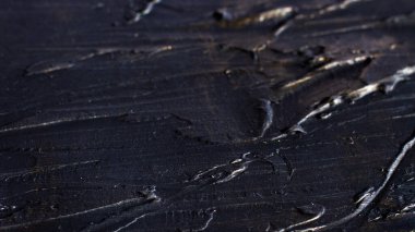 Bas-relief darkish textured drawings with golden plating