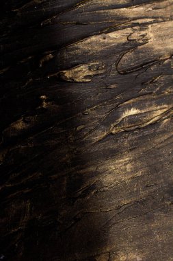 Micro-relief darkish textured drawings with golden platin