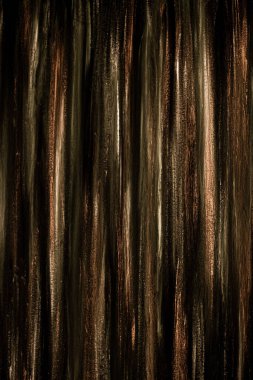 Abstract striped background. Wood texture. Gold stripes, dark stripes, black lines, elongated.