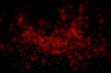 Black background with red stains, blur. Multi-colored sequins, stars, dust, glitter.