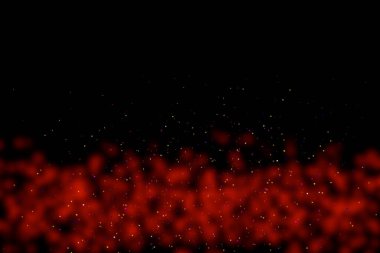 Black background with red stains, blur. Multi-colored sequins, stars, dust, glitter.