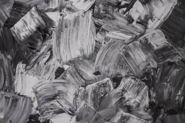 Rough strokes with a spatula. Plaster, painting. Gypsum, cement, wall. View. Substrate, under For an inscription. Grey, black and white.