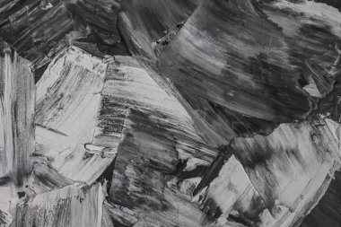 Rough strokes with a spatula. Plaster, painting. Gypsum, cement, wall. View. Substrate, under For an inscription. Grey, black and white.