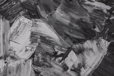 Rough strokes with a spatula. Plaster, painting. Gypsum, cement, wall. View. Substrate, under For an inscription. Grey, black and white.