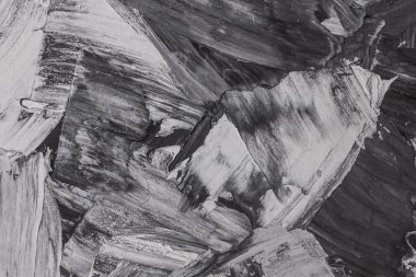 Rough strokes with a spatula. Plaster, painting. Gypsum, cement, wall. View. Substrate, under For an inscription. Grey, black and white.