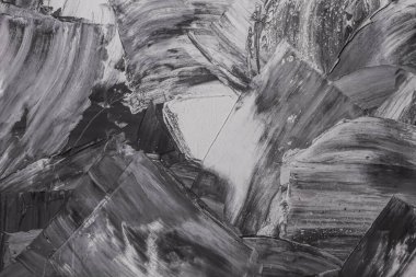 Rough strokes with a spatula. Plaster, painting. Gypsum, cement, wall. View. Substrate, under For an inscription. Grey, black and white.