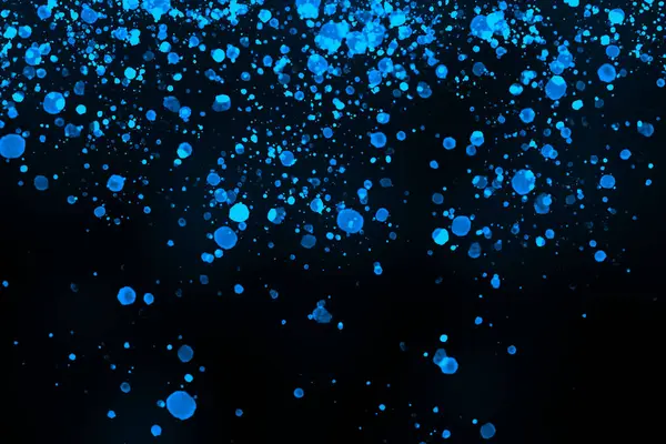 Black background with drops, dots, blots, megumi and dust. Of blue color.
