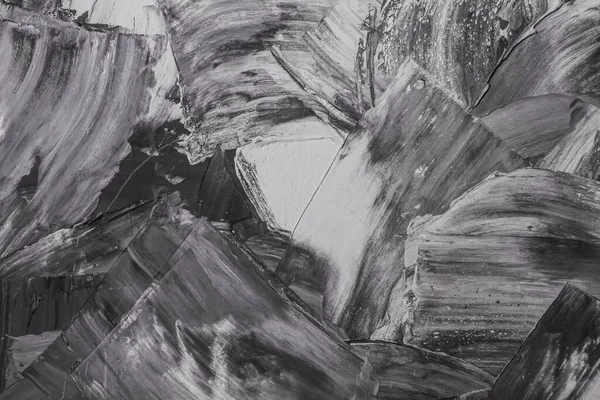 Rough strokes with a spatula. Plaster, painting. Gypsum, cement, wall. View. Substrate, under For an inscription. Grey, black and white.