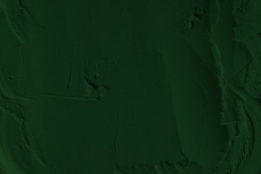 Küresel ısınma kavramı, tasarlamak için alanı olan siyah yeşil arka plan. Eski bir taş duvarın kabataslak yüzeyi. Yakın plan. Koyu yeşil zümrüt rengi. Geçmişi. Katı. Grunge. yeşil göz farı. Kraterler. yeşil toprak