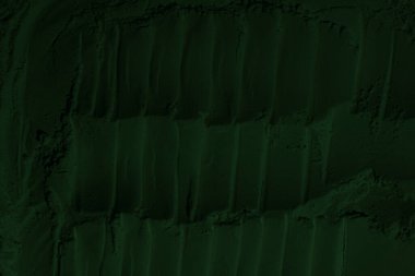 Küresel ısınma kavramı, tasarlamak için alanı olan siyah yeşil arka plan. Eski bir taş duvarın kabataslak yüzeyi. Yakın plan. Koyu yeşil zümrüt rengi. Geçmişi. Katı. Grunge. yeşil göz farı. Kraterler. yeşil toprak