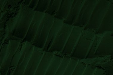 Küresel ısınma kavramı, tasarlamak için alanı olan siyah yeşil arka plan. Eski bir taş duvarın kabataslak yüzeyi. Yakın plan. Koyu yeşil zümrüt rengi. Geçmişi. Katı. Grunge. yeşil göz farı. Kraterler. yeşil toprak