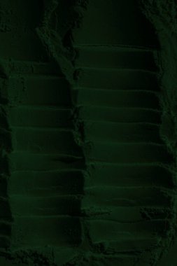 Küresel ısınma kavramı, tasarlamak için alanı olan siyah yeşil arka plan. Eski bir taş duvarın kabataslak yüzeyi. Yakın plan. Koyu yeşil zümrüt rengi. Geçmişi. Katı. Grunge. yeşil göz farı. Kraterler. yeşil toprak