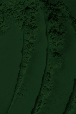 Küresel ısınma kavramı, tasarlamak için alanı olan siyah yeşil arka plan. Eski bir taş duvarın kabataslak yüzeyi. Yakın plan. Koyu yeşil zümrüt rengi. Geçmişi. Katı. Grunge. yeşil göz farı. Kraterler. yeşil toprak