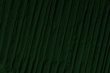 Küresel ısınma kavramı, tasarlamak için alanı olan siyah yeşil arka plan. Eski bir taş duvarın kabataslak yüzeyi. Yakın plan. Koyu yeşil zümrüt rengi. Geçmişi. Katı. Grunge. yeşil göz farı. Kraterler. yeşil toprak