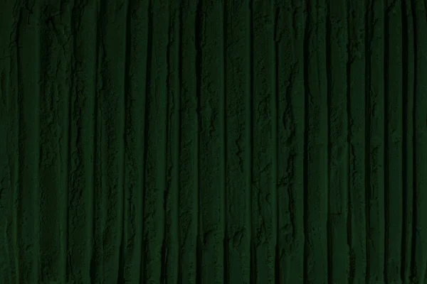 global warming concept, black green background with space for design. Toned rough surface of an old stone wall. Close-up. Dark emerald green color. Background. Solid. Grunge. green eyeshadow. Craters. green earth
