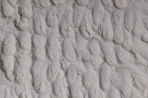 Un dokusu, toz, beyaz kum. - Beyaz. Şişkinlik, göçükler, çatlaklar, damga, krater.