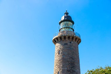 Lighthouse from the ground with blue sky from Denmark Lodbjerg Fyr. High quality photo