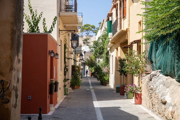 Small narrow alley with trees and plants in the town of Rethymnon in Crete. High quality photo
