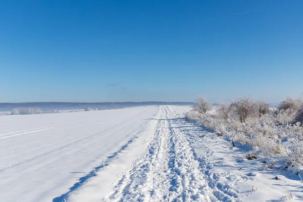 stock image Panorama snow landscape with tracks and blue sky. High quality photo