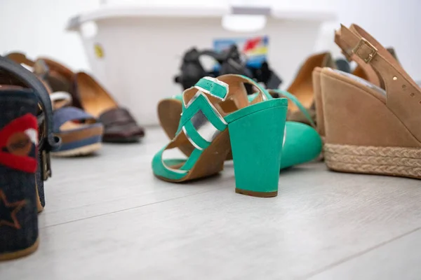 Group of shoes with high heels, color green and blue. High quality photo