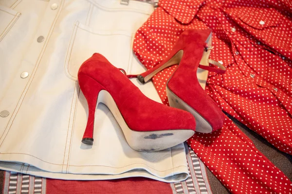 Clothing White Leather Skirt, Red Blouse, Very High Heel Shoes. High quality photo