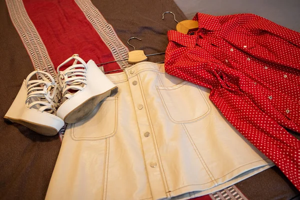 Clothing White Leather Skirt, Red Blouse, Very High White Wedge Heel Shoes. High quality photo