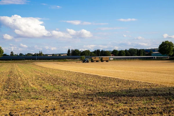 Stock image Panorama of a farmer's field with a tractor on it. High quality photo