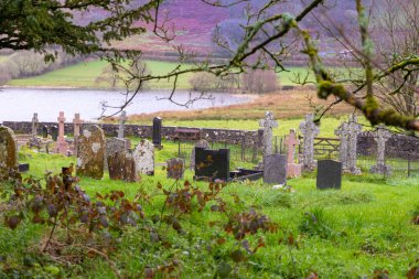 an old cemetery with large graves in cloudy weather. High quality photo clipart