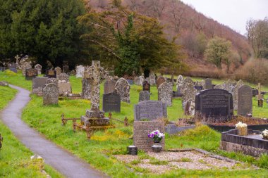 an old cemetery with large graves in cloudy weather. High quality photo clipart