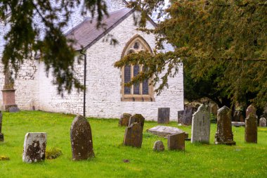 an old cemetery with large graves in cloudy weather. High quality photo clipart