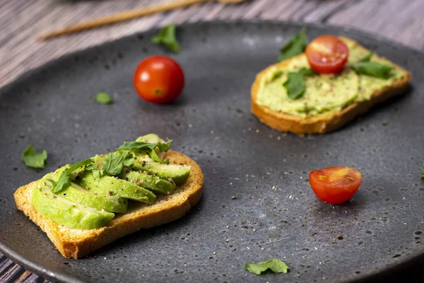 tasty breakfast of salmon toast with avocado and tomato