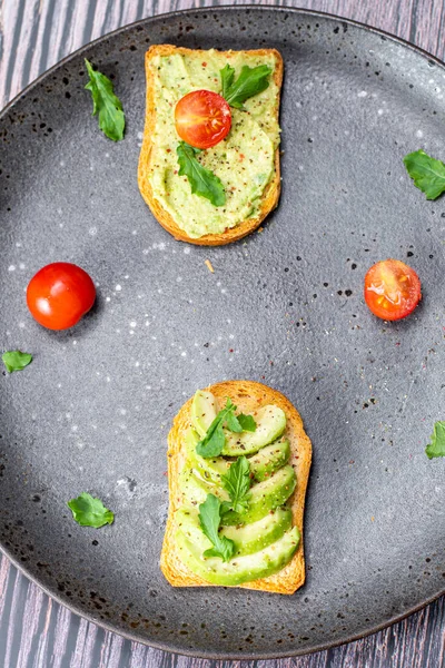 tasty breakfast of salmon toast with avocado and tomato
