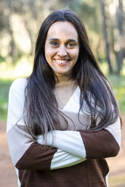 young girl relaxes walking through a beautiful forest at sunset