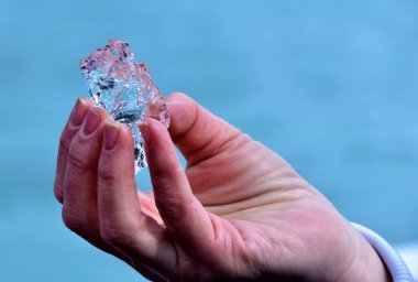 man holding 30000 year old ice in his hand 