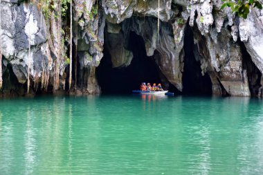 Palawan, Philippines - tourists on the boats visiting Puerto Princesa subterranean underground river