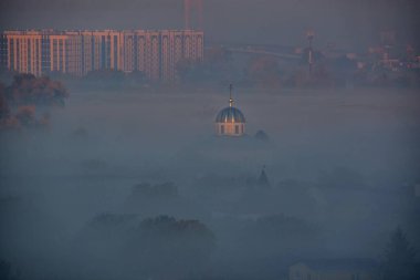 Aerial view of the city covered with fog in the morning at Kyiv, Ukraine