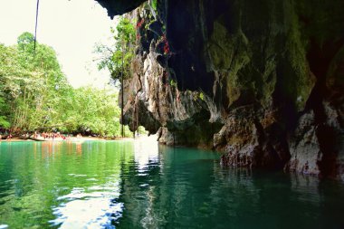 Palawan, Philippines - tourists on the boats visiting Puerto Princesa subterranean underground river