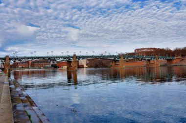 View of the Garonne River and bridge Saint-Pierre in Toulouse, France.