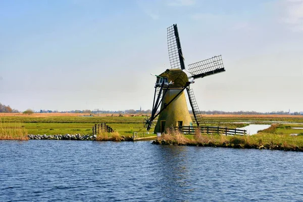 stock image Traditional dutch windmill near the canal. Netherlands