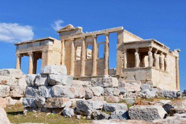 Porch of the Caryatids at temple of Athena Pollias or the Erechtheion at Acropolis site on a sunny evening in Athens Greece.