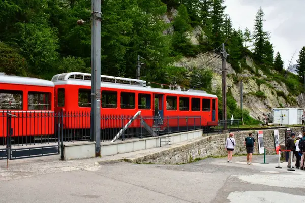 Chamonix-Mont-Blanc,France - June 22, 2023: A red train arriving at the Le Montenvers train station at Mer de Glace, a tourist attraction near Chamonix-Mont-Blanc