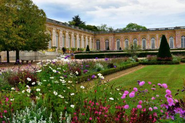 Versailles, France - October 2, 2022: Famous palace Versailles with beautiful gardens outdoors near Paris, France. 