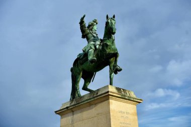 Versailles, France - October 2, 2022: Louis XIV statue outside the Royal Palace of Versailles