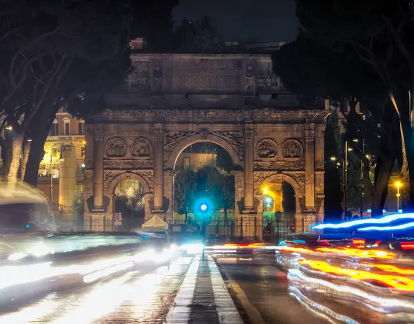Arc de Triomphe city lights and road, Rome, Italy