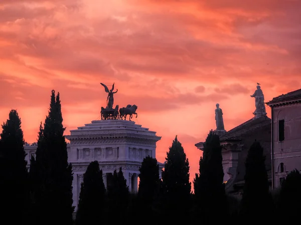 View of riders on Vittoriano at sunset, Rome, Italy