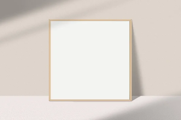 白い壁に空白の画像フレーム 現実的な正方形の写真フレームのモックアップ ライトウィンドウの影オーバーレイ効果を持つテーブルの上に木製のフレームモックアップ 空のポスターフレームモックアップ — ストック写真