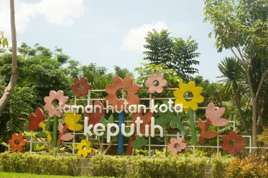 Surabaya, Indonesia - 14-01-2023 : City Forest Park, Keputih. One of the parks in the city of Surabaya. There is a beautiful bamboo forest and children's playground. A place for gathering and leisure.